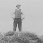 Man standing on a load of hay