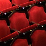 Photograph of red upholstered theater seats